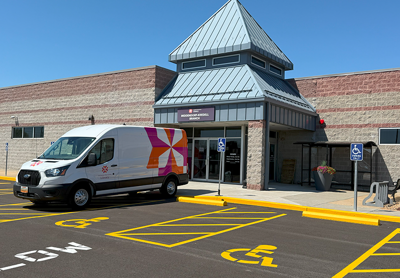 Exterior photo of Middendorf-Kredell Branch with a library van parked in front