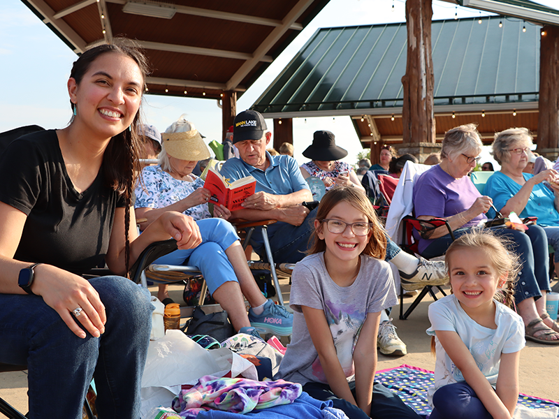 the community enjoying a free library event at the park