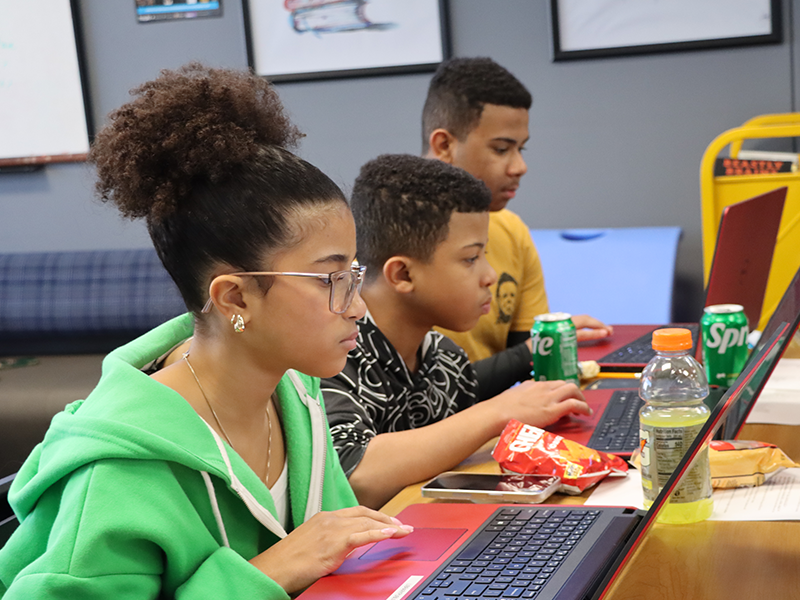 young teens using the library to stufy