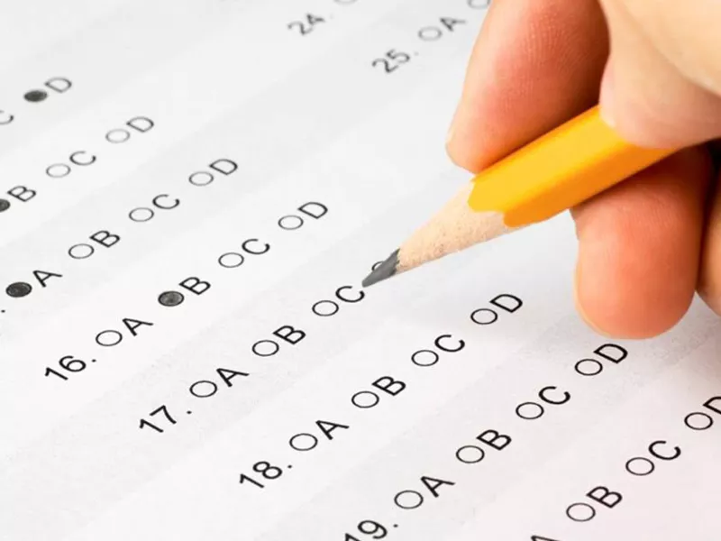 someone filling in bubbles for an exam