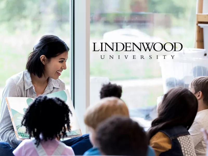 Lindenwood University student reading to kids