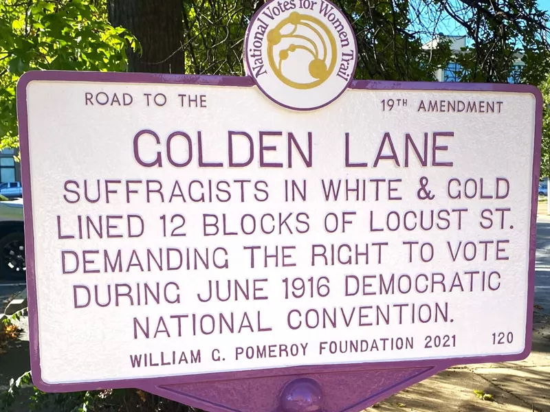 A sign that reads Road to the Golden Lane, Suffragists in White and Gold lined 12 blocks of Locust St. demanding the right to vote during june 1916 democratic national convention William G. Pomery Foundation 2021