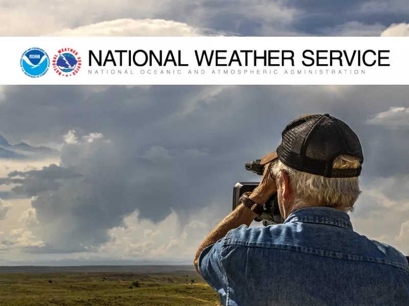 man observing storm clouds with the National Weather Service banner at the top