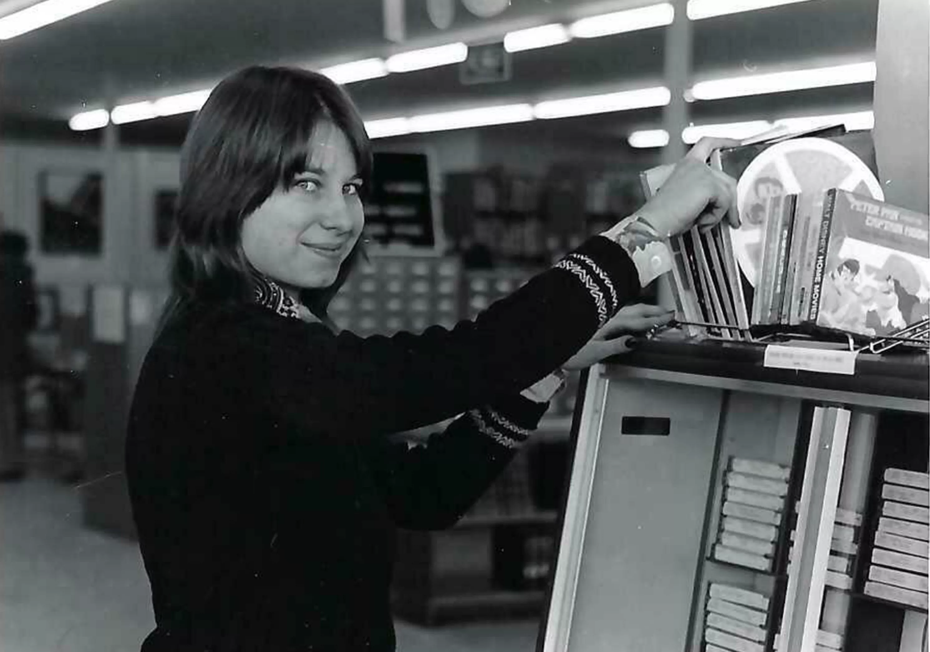 Image of woman searching through CDs